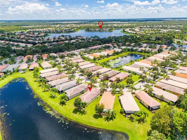 bird's eye view featuring a residential view and a water view