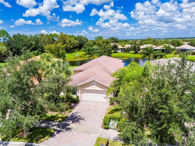 birds eye view of property with a water view