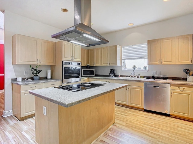 kitchen featuring island exhaust hood, stainless steel appliances, light brown cabinets, a center island, and light hardwood / wood-style floors