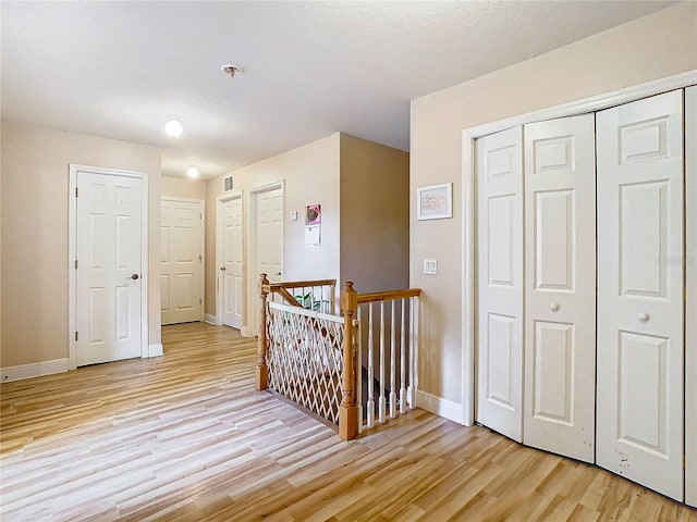 hallway featuring light hardwood / wood-style flooring