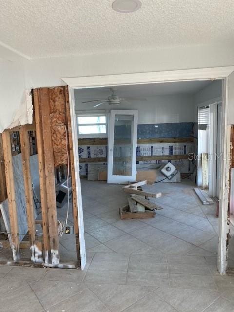 miscellaneous room with a textured ceiling