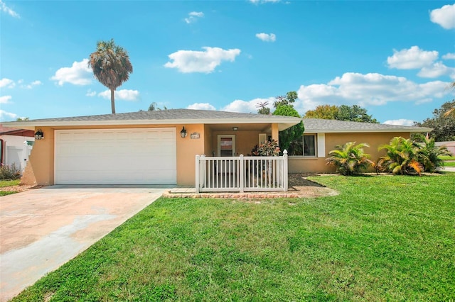 single story home featuring a garage and a front yard