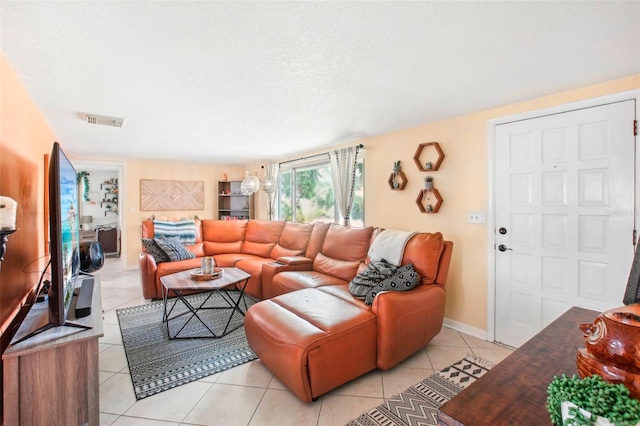 tiled living room with a textured ceiling