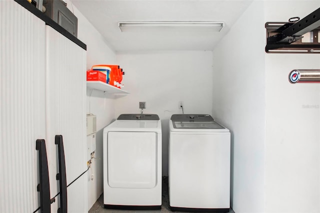 washroom with independent washer and dryer