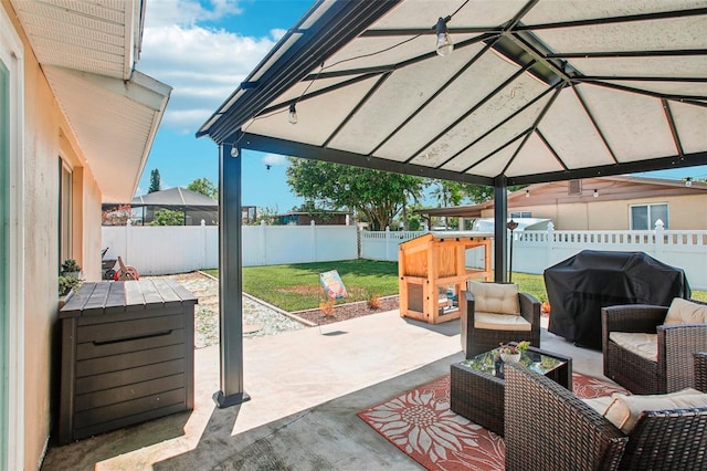 view of patio / terrace with a grill, outdoor lounge area, and a gazebo