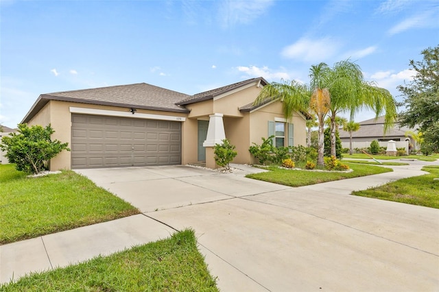 view of front of house with a garage and a front lawn