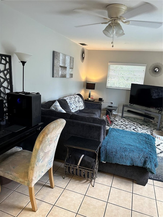 living room featuring ceiling fan and light tile patterned floors