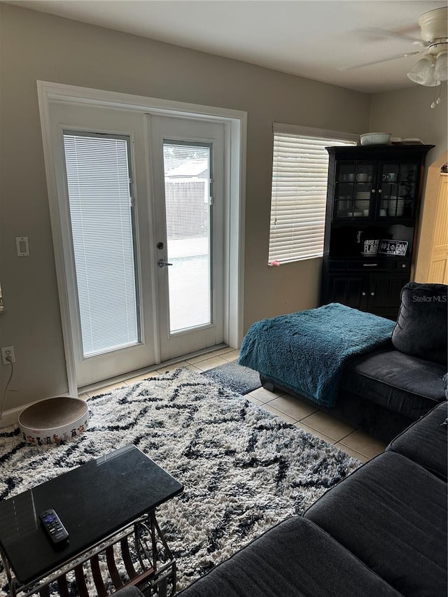 bedroom with ceiling fan and light tile patterned floors