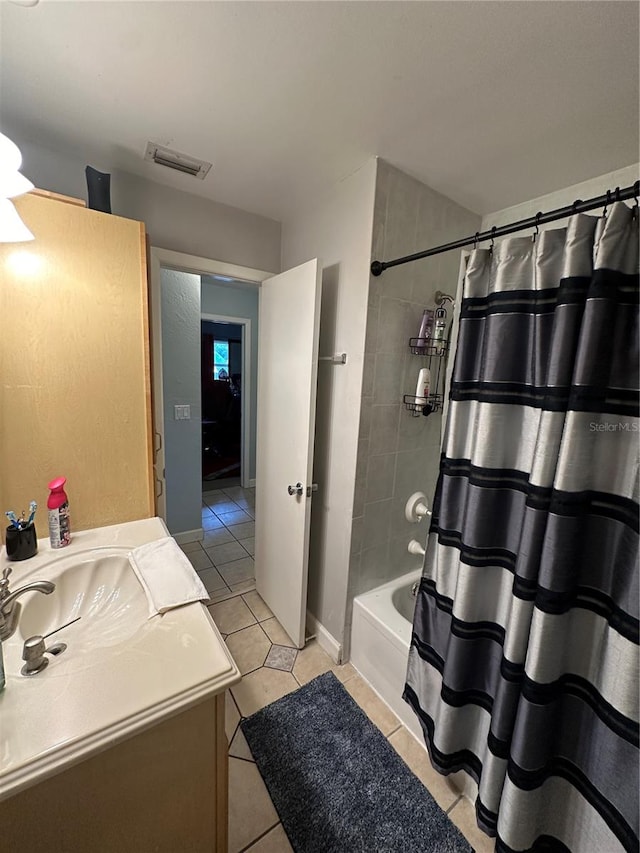 bathroom with tile patterned flooring, shower / tub combo, and vanity