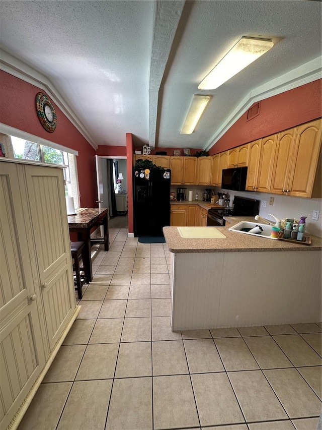 kitchen featuring lofted ceiling, black appliances, kitchen peninsula, and a textured ceiling