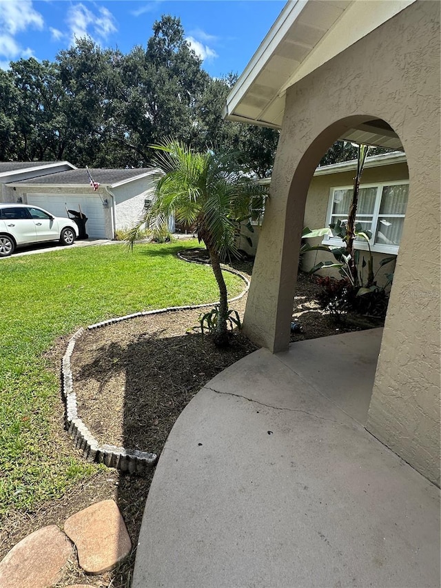 view of yard featuring a garage