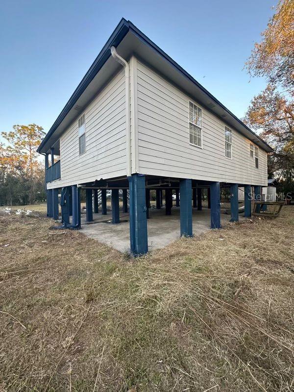 view of home's exterior featuring a carport