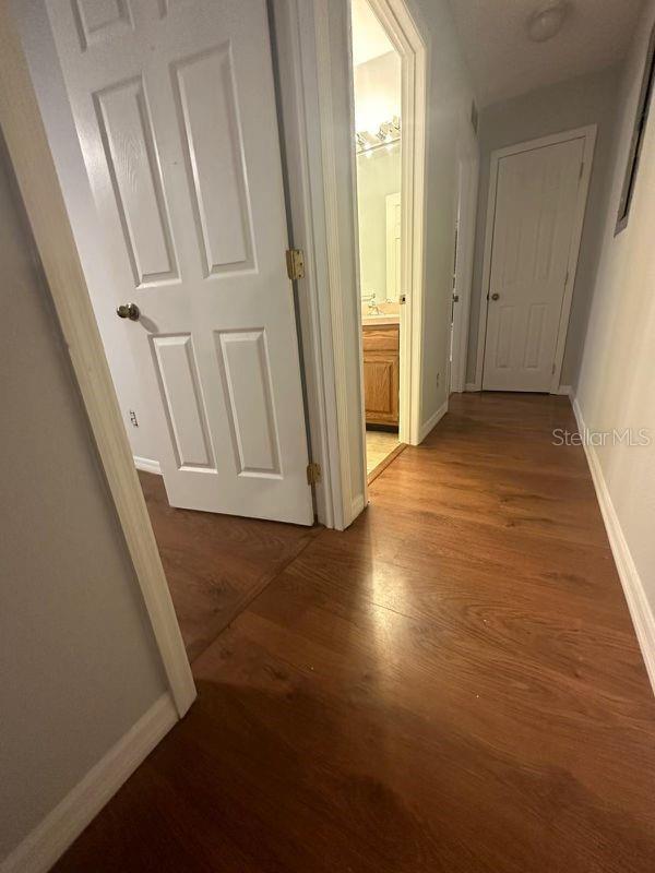 hallway featuring hardwood / wood-style flooring