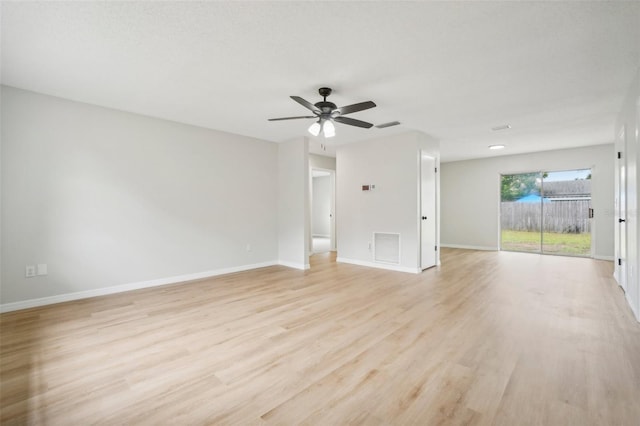 spare room featuring light hardwood / wood-style flooring and ceiling fan