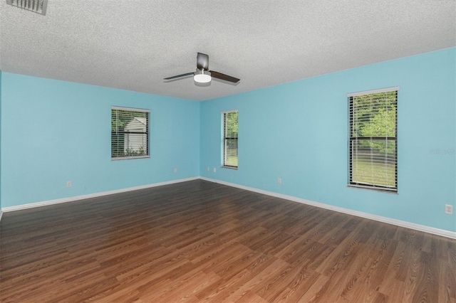 unfurnished room featuring a textured ceiling, ceiling fan, and hardwood / wood-style floors