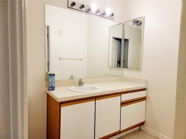 bathroom with tile patterned flooring and vanity