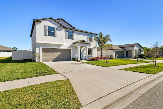 view of front of property featuring a garage and a front yard