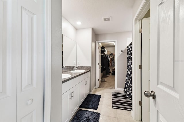 bathroom with vanity and tile patterned flooring