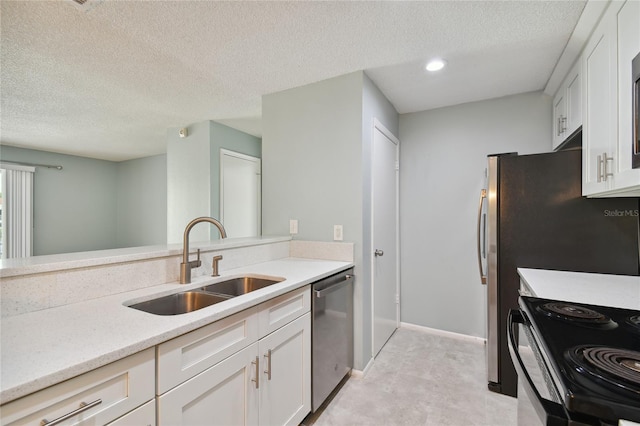 kitchen featuring electric range, stainless steel dishwasher, white cabinetry, a sink, and a textured ceiling