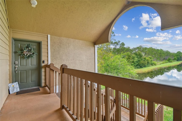 balcony featuring a water view