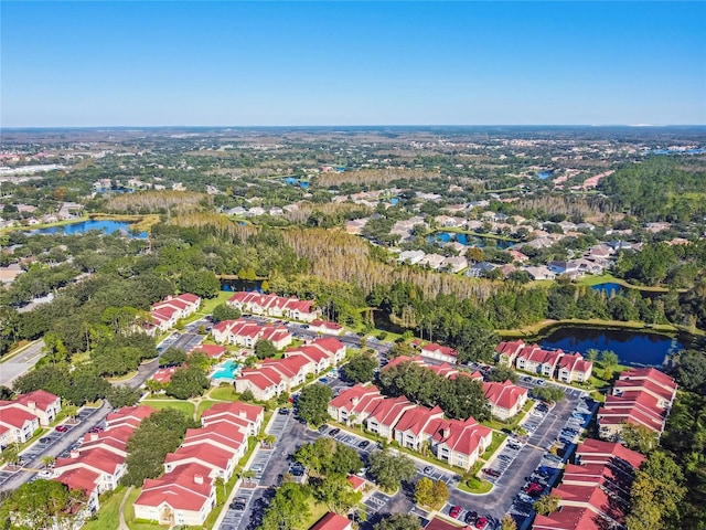 drone / aerial view featuring a water view and a residential view