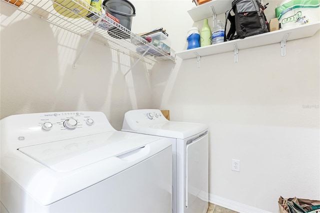 clothes washing area featuring washing machine and clothes dryer