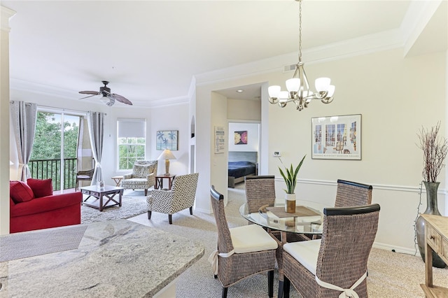 dining room featuring light colored carpet, visible vents, ornamental molding, baseboards, and ceiling fan with notable chandelier