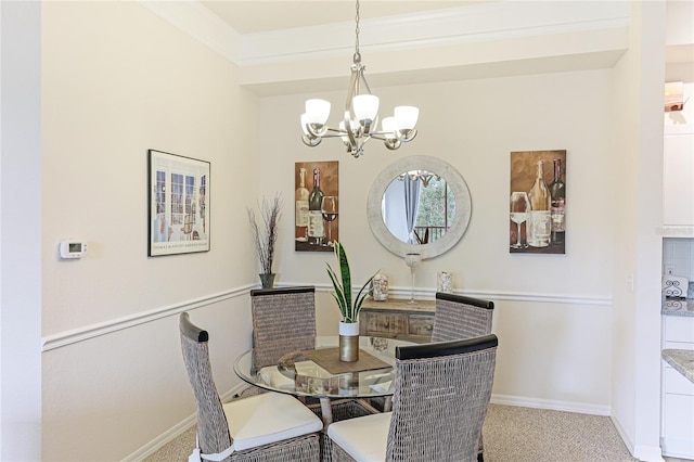 carpeted dining space with crown molding and a notable chandelier