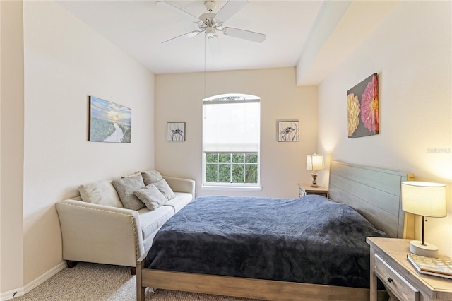 bedroom featuring light colored carpet, ceiling fan, and baseboards