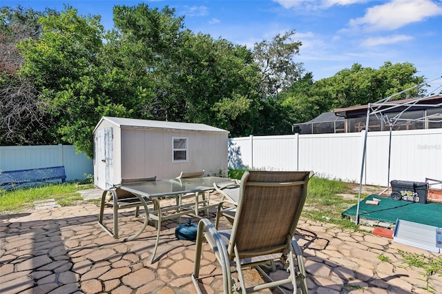 view of patio / terrace featuring a storage unit