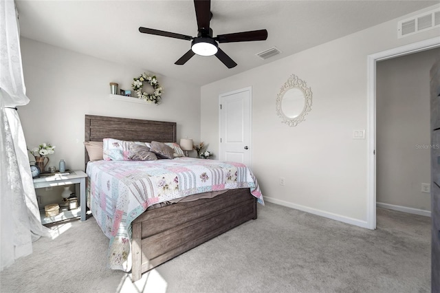 bedroom featuring carpet, visible vents, and a ceiling fan
