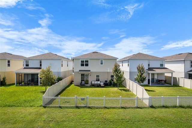 back of property with a patio, a residential view, a fenced backyard, and a yard