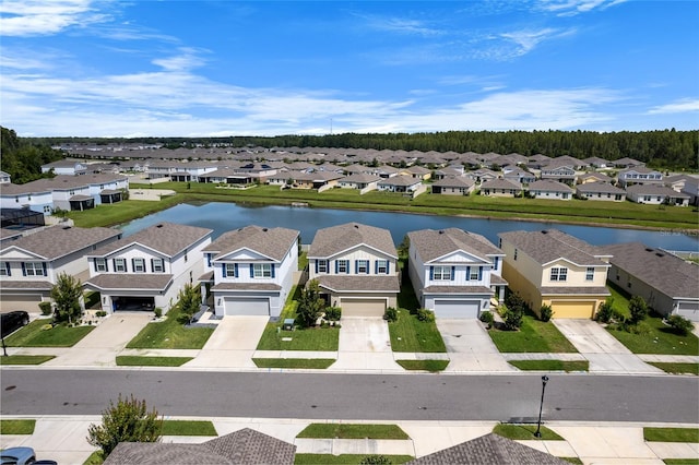 aerial view with a water view and a residential view