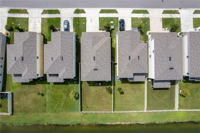aerial view with a residential view and a water view