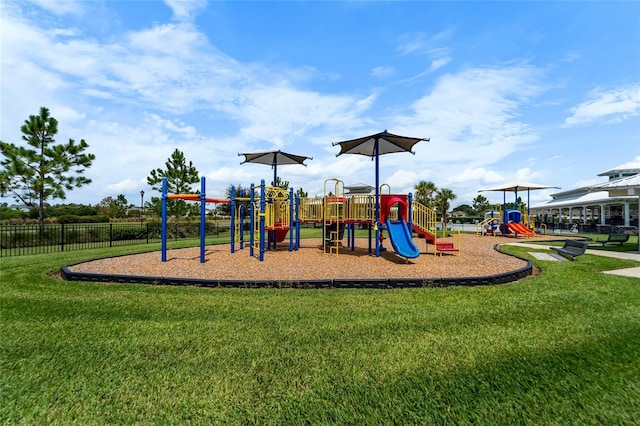 communal playground featuring a yard