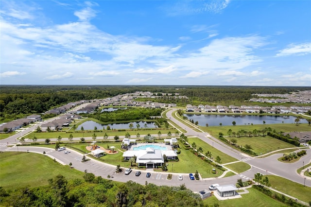 birds eye view of property with a residential view and a water view
