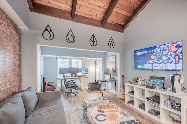 living area with beam ceiling, high vaulted ceiling, wood ceiling, and wood finished floors