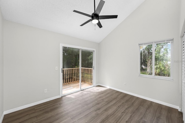 unfurnished room featuring hardwood / wood-style flooring, ceiling fan, and high vaulted ceiling