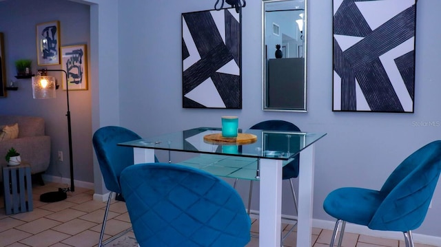 dining space with light tile patterned floors