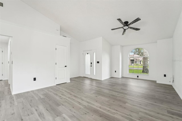 unfurnished living room featuring lofted ceiling, ceiling fan, and light hardwood / wood-style flooring