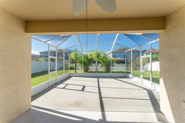 view of patio / terrace with glass enclosure and ceiling fan