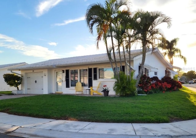 view of front facade with a garage and a front yard