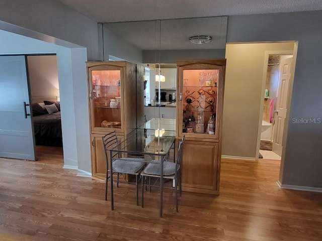 interior space featuring hardwood / wood-style flooring and hanging light fixtures