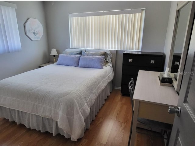 bedroom featuring hardwood / wood-style flooring