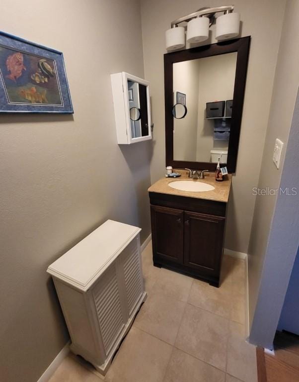 bathroom with tile patterned floors and vanity