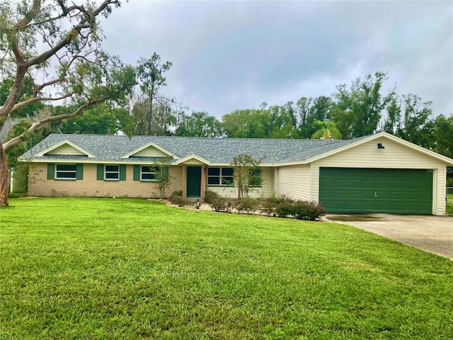 single story home featuring a garage and a front yard