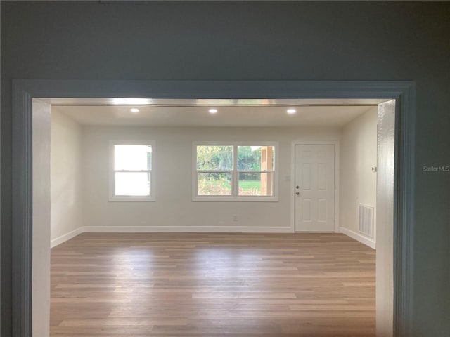 spare room featuring light wood-type flooring