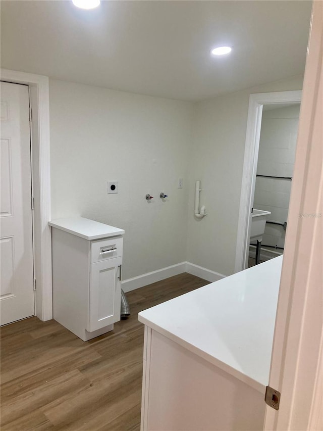 bathroom with hardwood / wood-style flooring