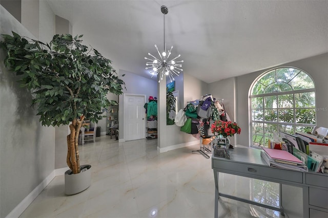 interior space featuring lofted ceiling and a chandelier