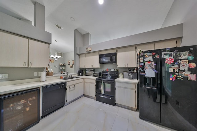 kitchen featuring hanging light fixtures, a notable chandelier, sink, black appliances, and wine cooler